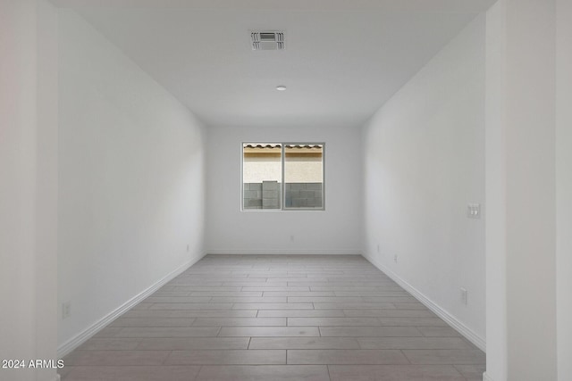 unfurnished room with light hardwood / wood-style floors