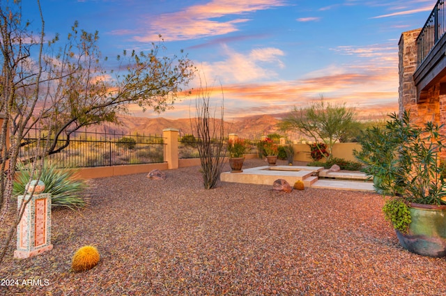 yard at dusk with a mountain view