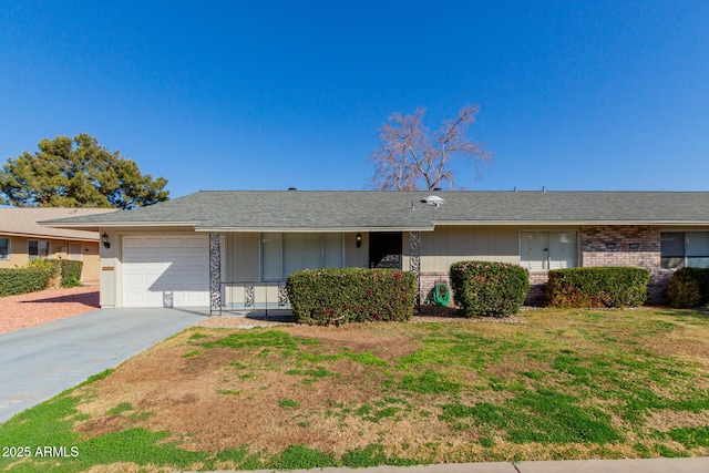 ranch-style house with a garage and a front yard