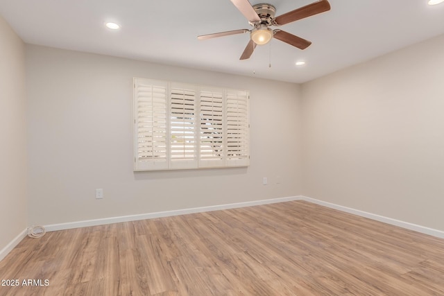 unfurnished room with ceiling fan and light hardwood / wood-style flooring