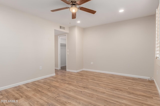 unfurnished room featuring ceiling fan and light hardwood / wood-style flooring