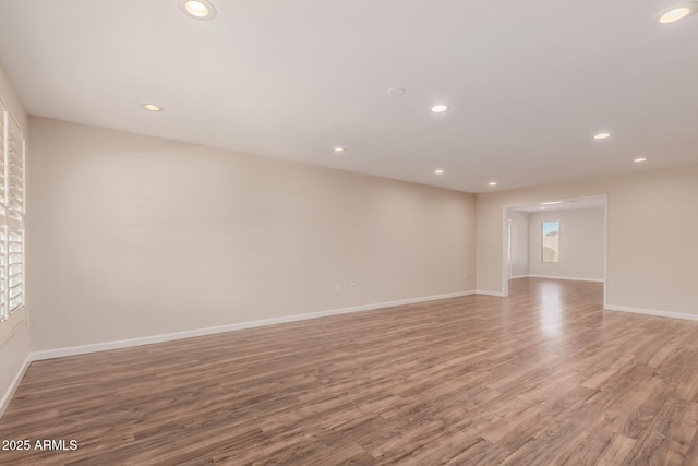 empty room with hardwood / wood-style floors