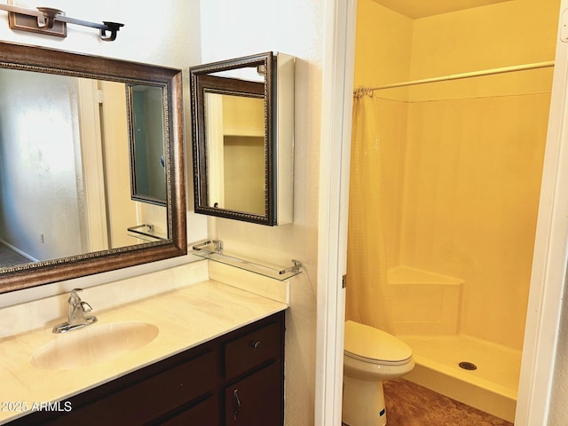 bathroom with toilet, curtained shower, and vanity