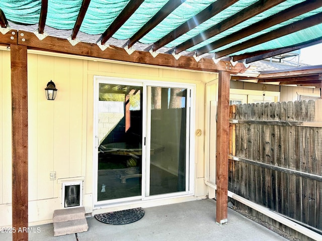 entrance to property with a patio