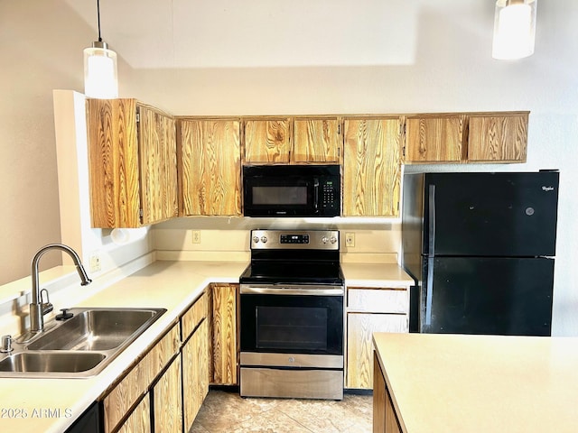 kitchen with black appliances, decorative light fixtures, and sink