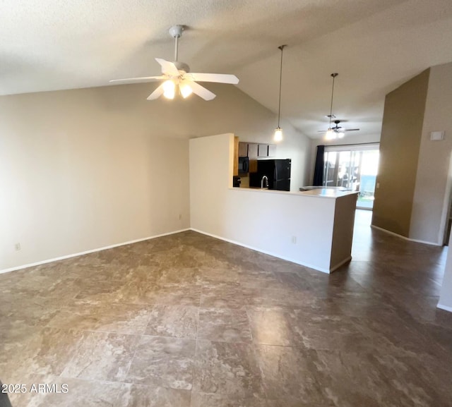 kitchen with vaulted ceiling, ceiling fan, kitchen peninsula, hanging light fixtures, and black appliances