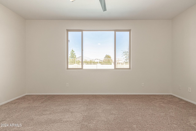 carpeted empty room with ceiling fan