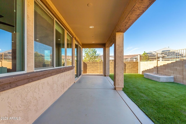 view of patio featuring fence