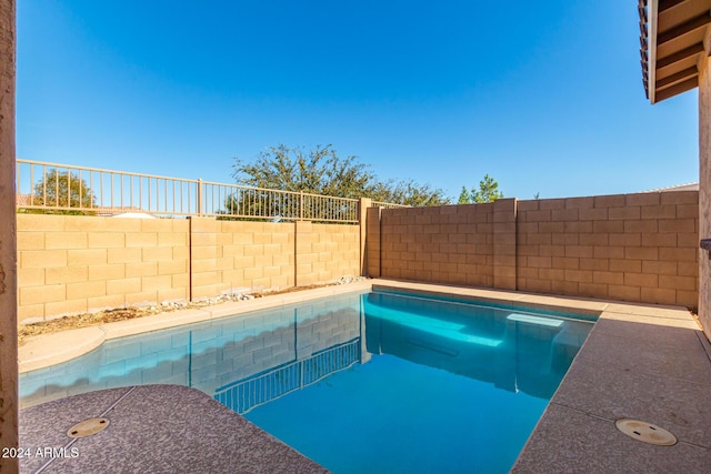 view of pool featuring a fenced in pool and a fenced backyard