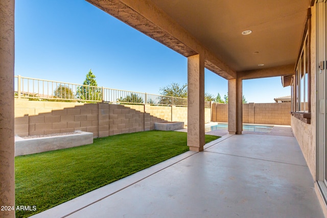 view of patio featuring a fenced in pool