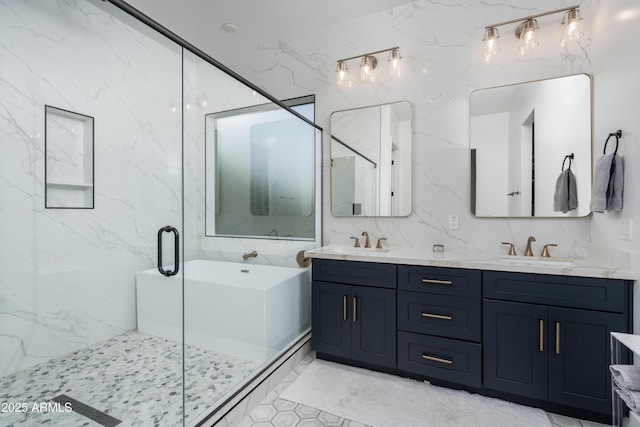 full bath featuring double vanity, a soaking tub, a sink, and a stall shower