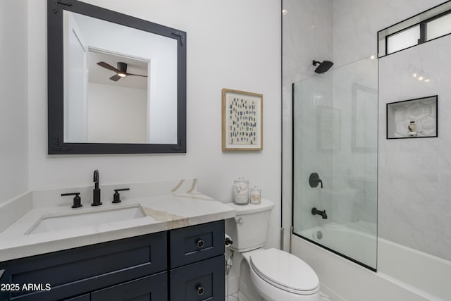 full bath featuring enclosed tub / shower combo, vanity, and toilet