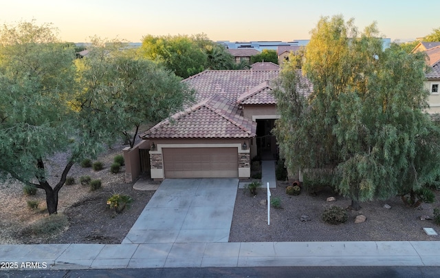 3622 E Sparrow Pl, Chandler, AZ 85286 - view of front of property featuring a tile roof, stucco siding, a garage, concrete driveway, and stone siding