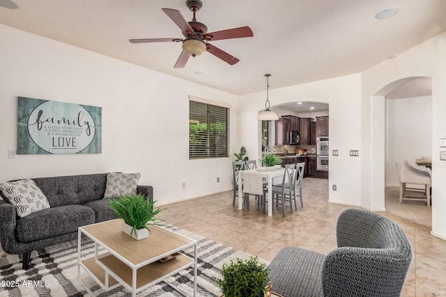 3622 E Sparrow Pl, Chandler, AZ 85286 - living room featuring arched walkways, a ceiling fan, recessed lighting, and light tile patterned flooring