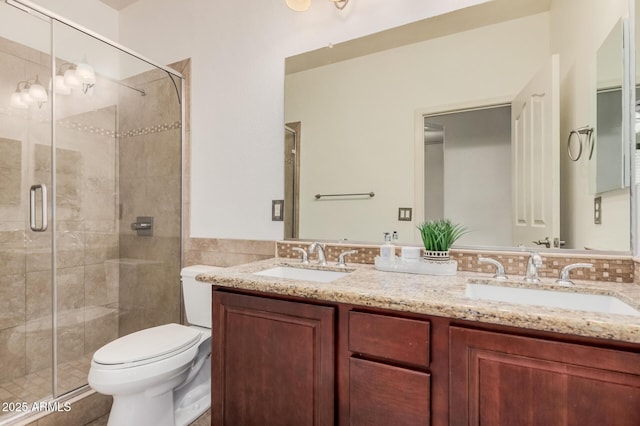 3622 E Sparrow Pl, Chandler, AZ 85286 - bathroom featuring double vanity, a shower stall, tile walls, and a wainscoted wall
