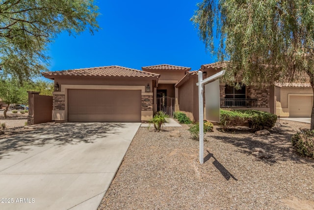 3622 E Sparrow Pl, Chandler, AZ 85286 - mediterranean / spanish home with stucco siding, a tiled roof, a garage, driveway, and stone siding