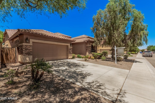 3622 E Sparrow Pl, Chandler, AZ 85286 - view of front facade featuring stone siding, a tile roof, stucco siding, and concrete driveway