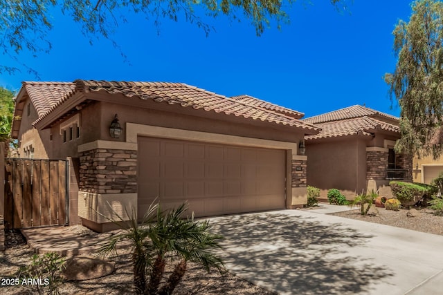 3622 E Sparrow Pl, Chandler, AZ 85286 - view of front of house featuring stone siding, stucco siding, a garage, driveway, and a tiled roof