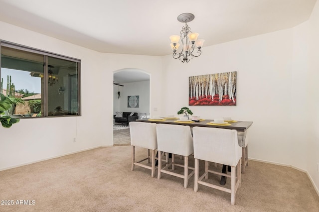 3622 E Sparrow Pl, Chandler, AZ 85286 - carpeted dining room with arched walkways and a chandelier