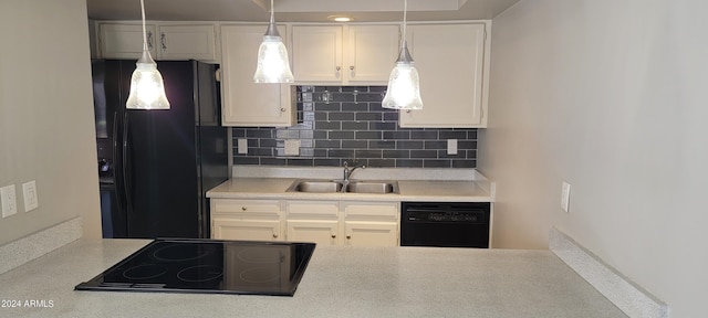 kitchen featuring white cabinets, sink, tasteful backsplash, and black appliances