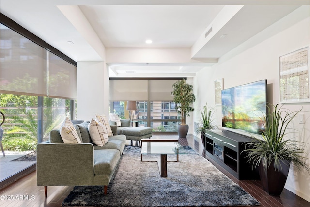 living room featuring visible vents, wood finished floors, and recessed lighting