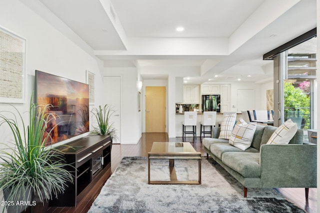 living area with recessed lighting and wood finished floors