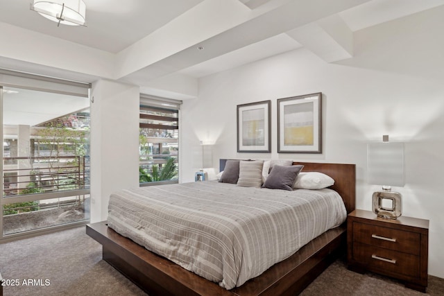 bedroom with dark colored carpet