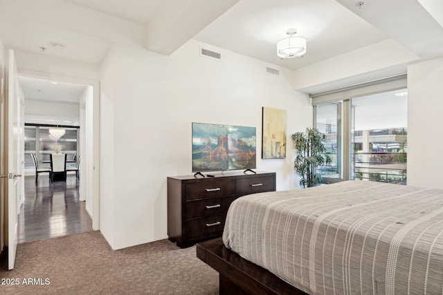 carpeted bedroom with visible vents