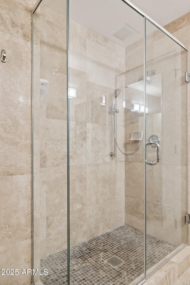 full bath with a shower stall