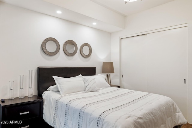 bedroom featuring recessed lighting and a closet