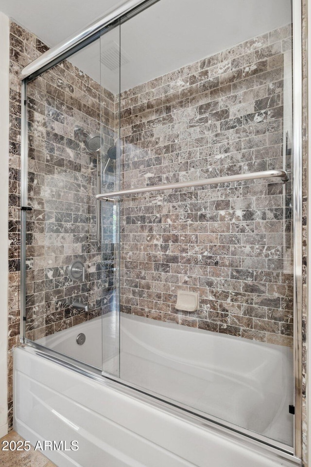bathroom featuring enclosed tub / shower combo