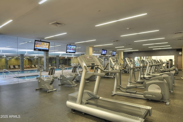 exercise room featuring visible vents
