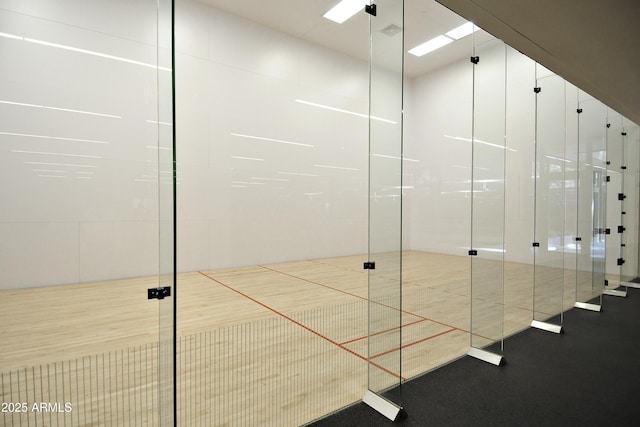 view of property's community with a sport court