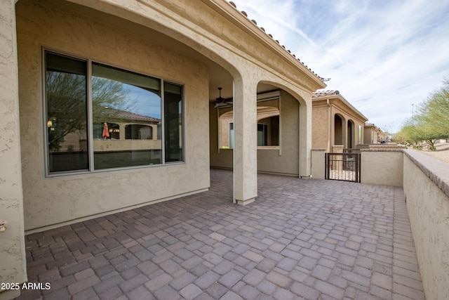 view of patio with a gate