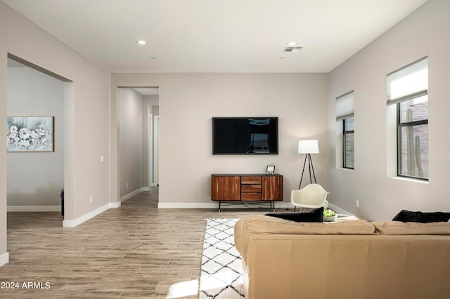 living room with light hardwood / wood-style flooring