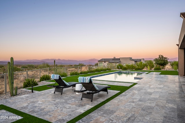 exterior space with a mountain view and a patio