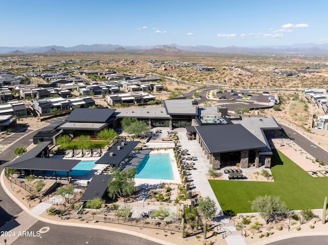 birds eye view of property with a mountain view