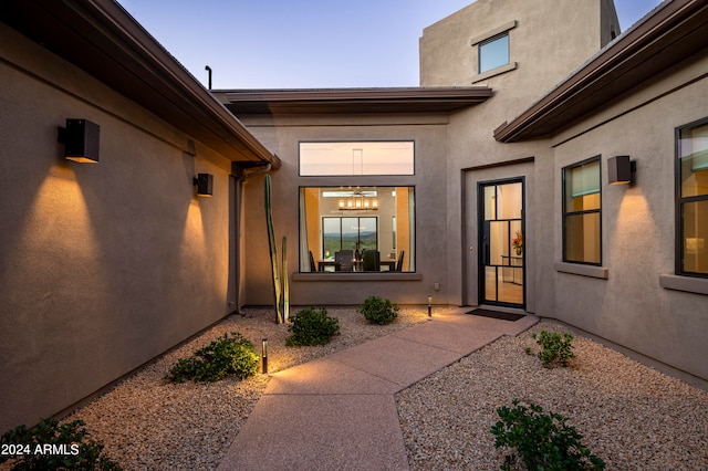 entrance to property featuring a patio area