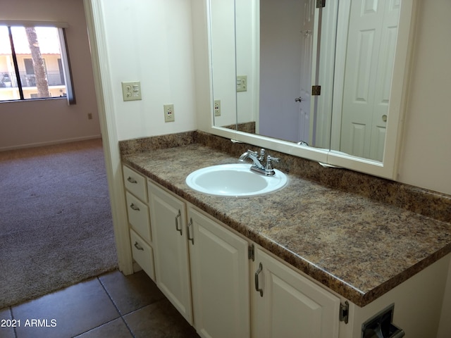 bathroom with vanity and tile patterned flooring