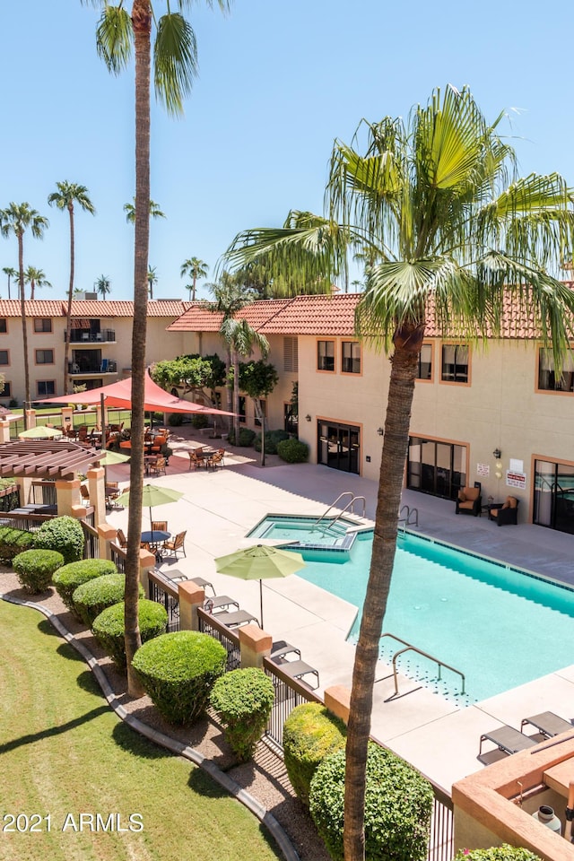 view of swimming pool featuring a patio area