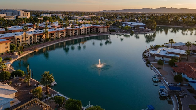 aerial view at dusk with a water view