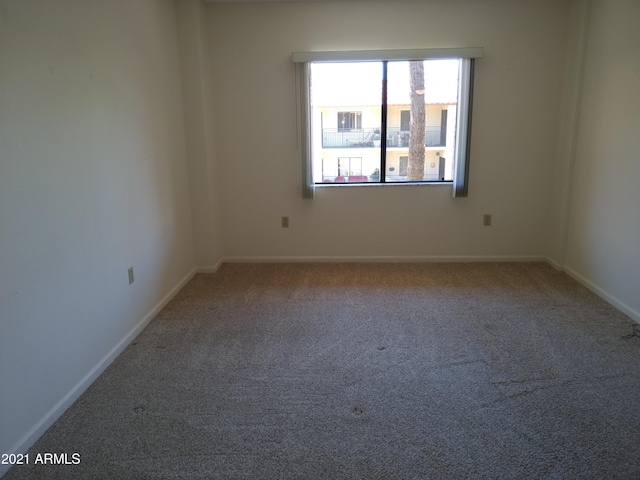 empty room featuring carpet flooring