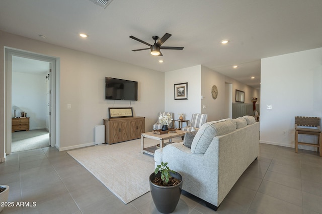 living area with ceiling fan, light tile patterned flooring, baseboards, and recessed lighting