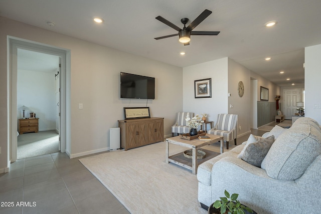 tiled living area featuring baseboards, a ceiling fan, and recessed lighting