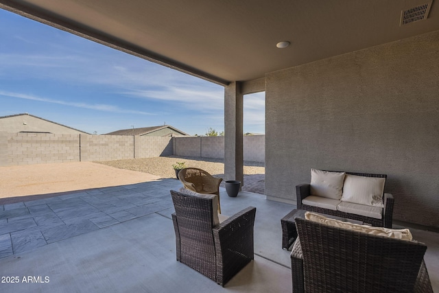 view of patio with an outdoor hangout area, a fenced backyard, and visible vents