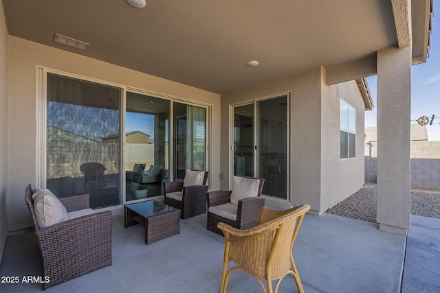 view of patio / terrace featuring visible vents and an outdoor hangout area