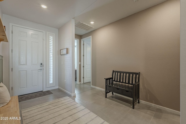 entrance foyer with recessed lighting, light tile patterned flooring, visible vents, and baseboards