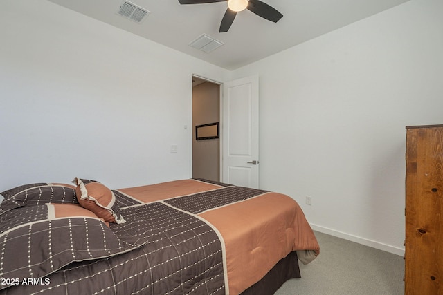 carpeted bedroom featuring baseboards, visible vents, and a ceiling fan