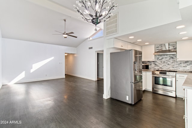 kitchen featuring dark wood-type flooring, stainless steel appliances, wall chimney range hood, high vaulted ceiling, and white cabinets