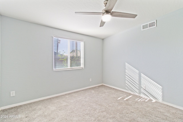 empty room with carpet flooring and ceiling fan